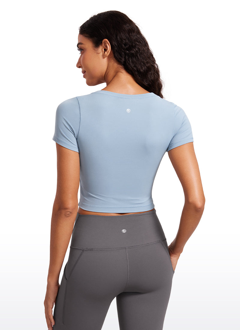 CRZ YOGA Camiseta Cropped de Manga Corta con Escote Redondeado Mujer Batista Azul